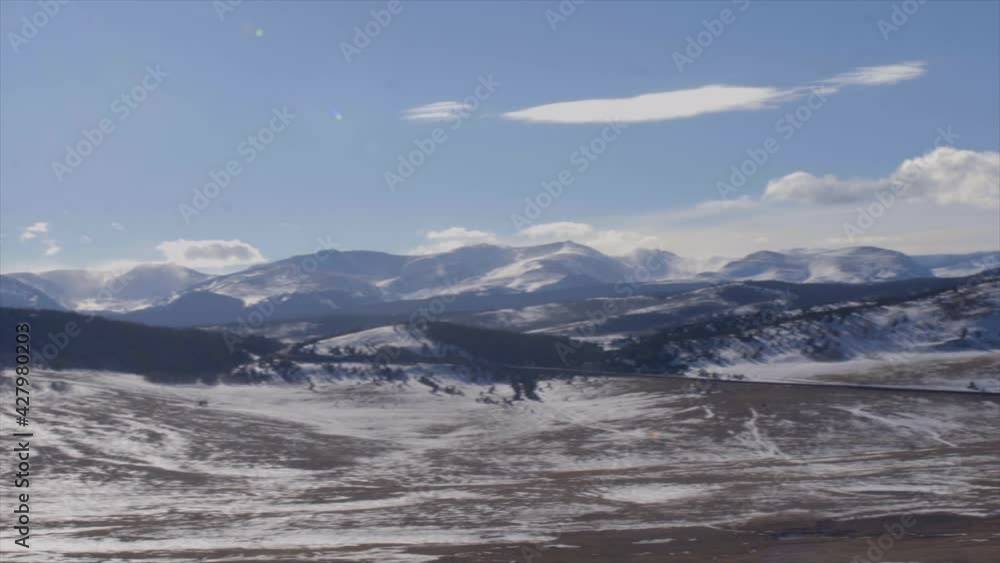 Slow pan across mountainous skyline in Colorado. Slow pan across mountainous skyline in Colorado.