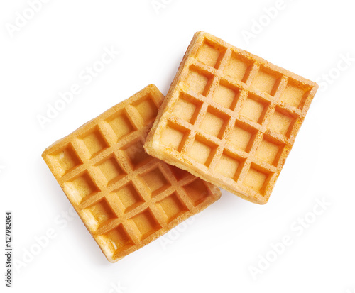 Fotografie Two waffles isolated on white background. Top view of waffle.