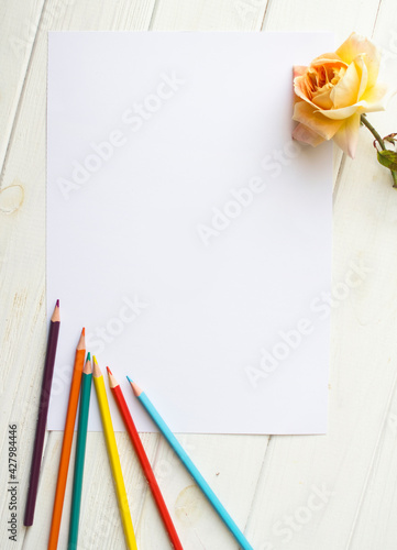 Mockup for A4 paper with single rose and drawing material