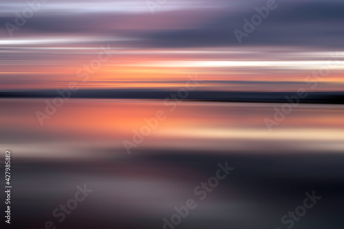 Abstract sunset on the water © Adam
