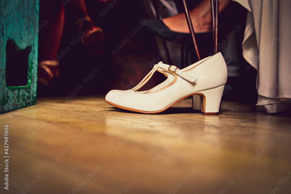 Naklejka premium white bridal shoes on the floor