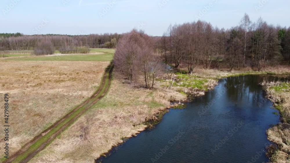 Low flight over the small Grabia River, Poland. Low flight over the small Grabia River, Poland.