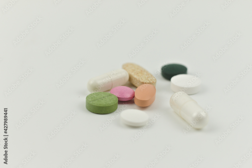 Close up of variety of colorful pills, capsules, and tablets Close up of variety of colorful pills, capsules, and tablets