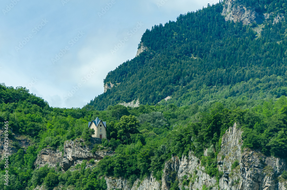Fototapeta premium Church in the middle of the mountains, beautiful landscape. North of Italy 