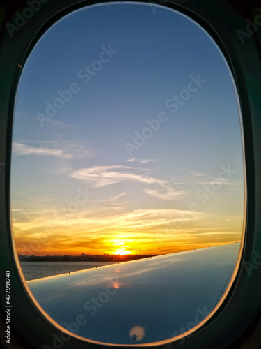 looking at the sunset from a plane window