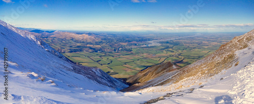 view of the valley from the top of the mountain in new zealand