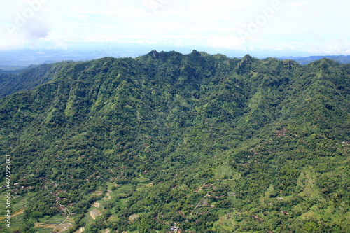 Aerial view of the green cliffs or hills of Menoreh extending from the west of Yogyakarta to Purworejo, Central Java.  © Bari