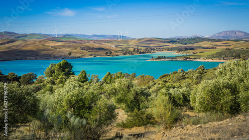 View on the turquoise water of the Guadalhorce and Guadalteba Reservoirs, two artificial lakes in the andalusian backcountry in Spain