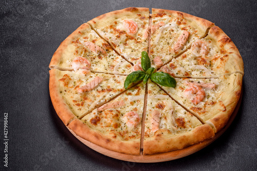 Delicious fresh seafood oven pizza: red fish and shrimp