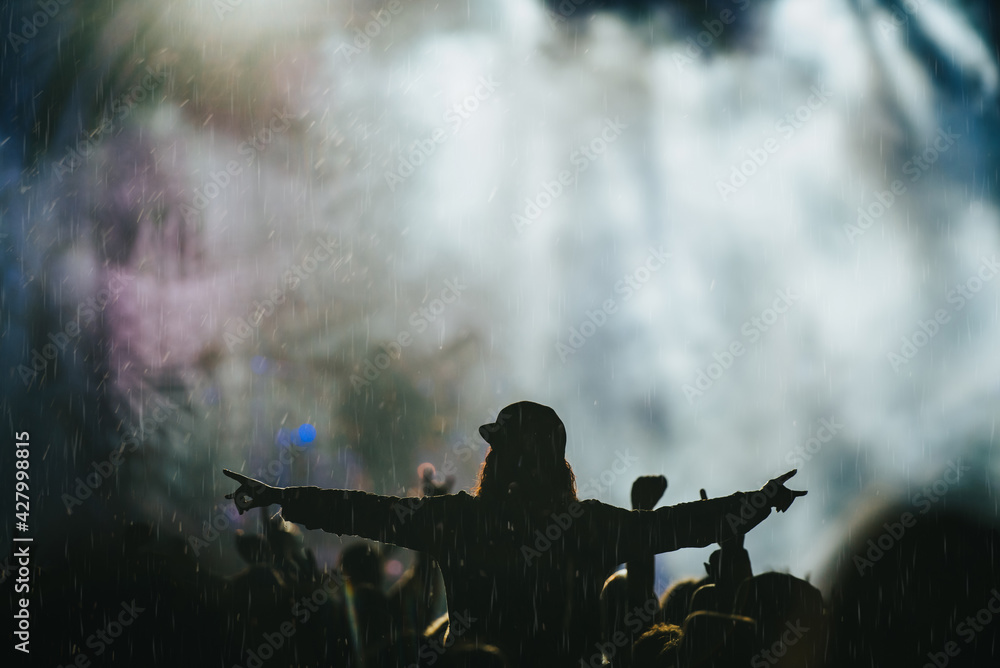 Silhouette of a man in a concert crowd