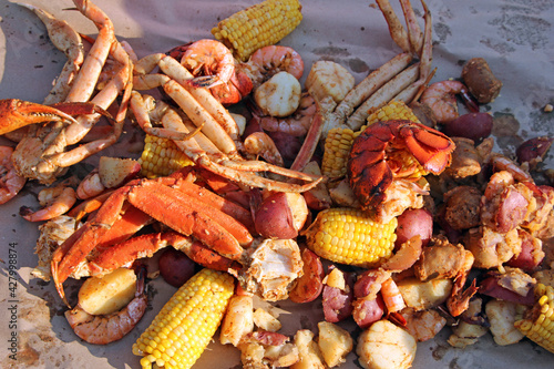 A colorful seafood steamer will be a delicious feast at the beach that includes crab legs, lobster, scallops, shrimp, corn on the cob and potatoes.