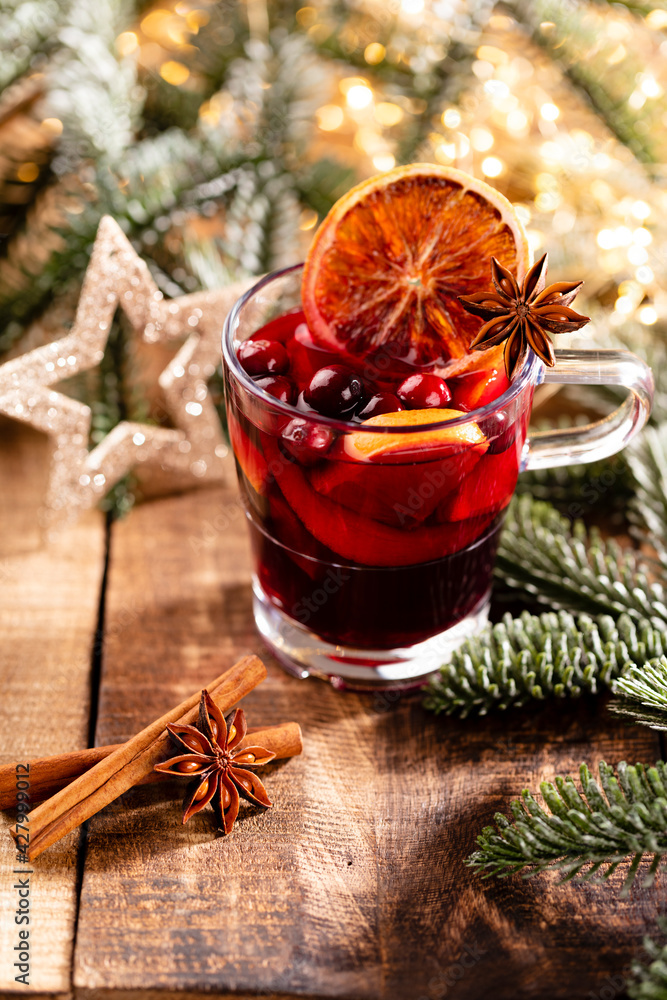 Christmas mulled wine with spices on a wooden rustic table. Christmas mulled wine with spices on a wooden rustic table.