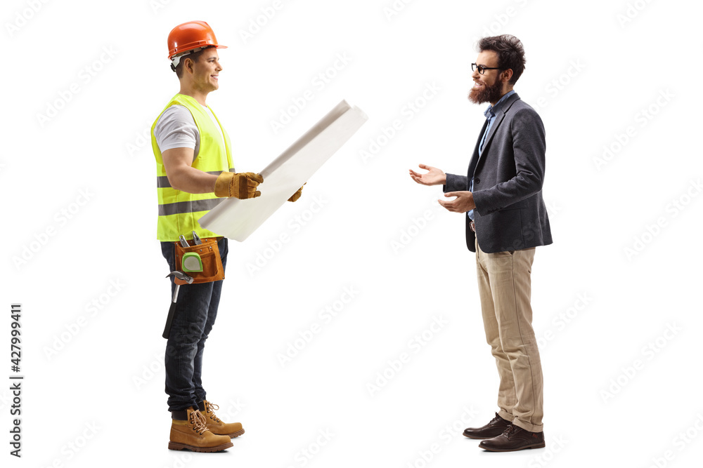 Full length profile shot of a builder with a blueprint talking to a bearded man Full length profile shot of a builder with a blueprint talking to a bearded man