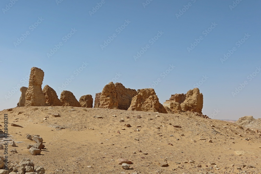 The walls and ruins of Dimeh el Sibaa (Soknopaiou Nesos) in Fayoum city desert in Egypt The walls and ruins of Dimeh el Sibaa (Soknopaiou Nesos) in Fayoum city desert in Egypt