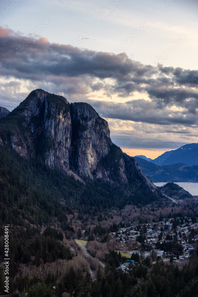 Squamish, North of Vancouver, British Columbia, Canada. View from the top of the Mount Crumpit of a small town surrounded by Canadian Mountain Landscape. Spring Sunset