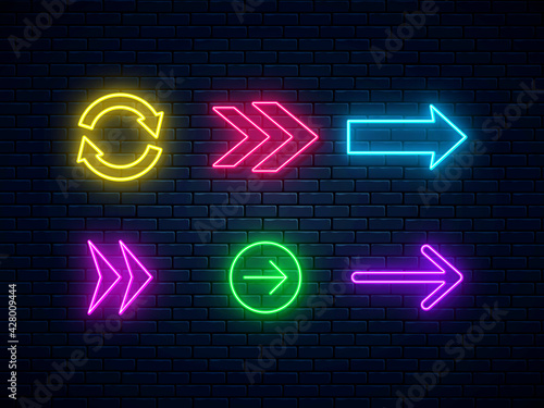 Neon arrow signs collection. Set of colorful neon arrows, web icons. Bright arrow pointer symbols on brick wall background. Banner design, bright advertising signboard elements. Vector illustration.