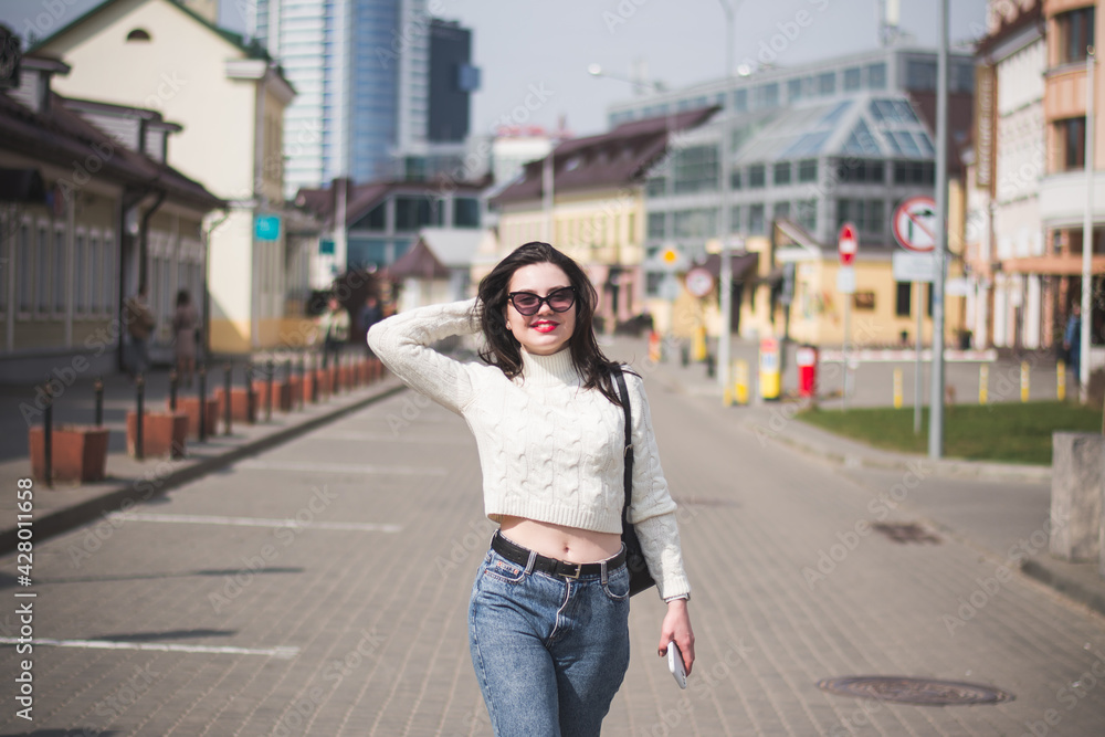 lifestyle fashion portrait of young stylish hipster woman