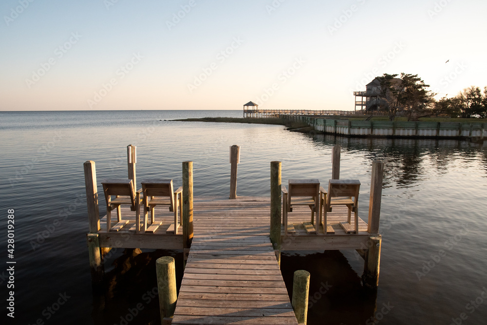 Fototapeta premium Chairs on the edge of the Ocean