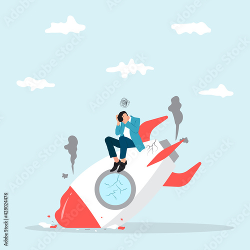 Business start up failure, new business risk or unexpected entrepreneur bankruptcy concept, depressed businessman company owner sitting on crash launching spaceship metaphor of new business failure.