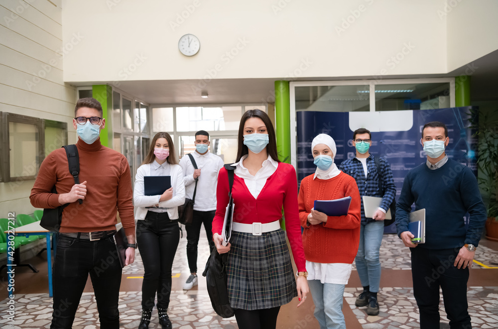 students group at university walking and wearing face mask