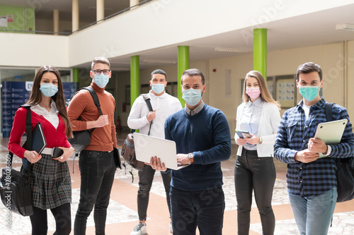 Multiethnic students group wearing protective face mask