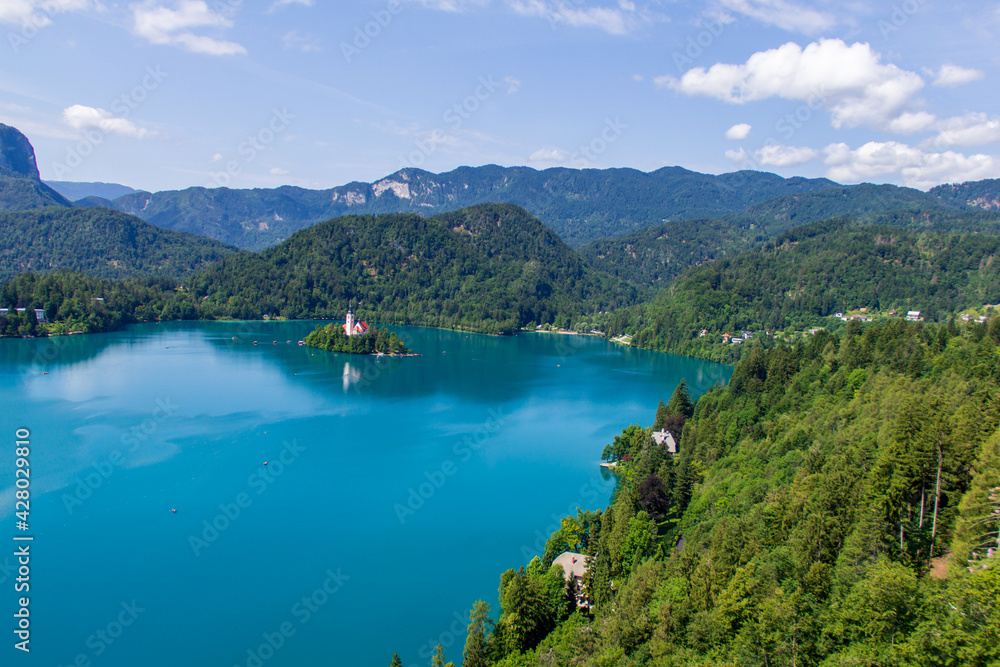 View over the cristal blue Bled lake during sunny summer day in Slovenian mountains. 