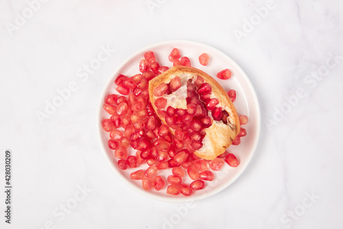 Fresh ripe pomegranate with clipping path on white background.
