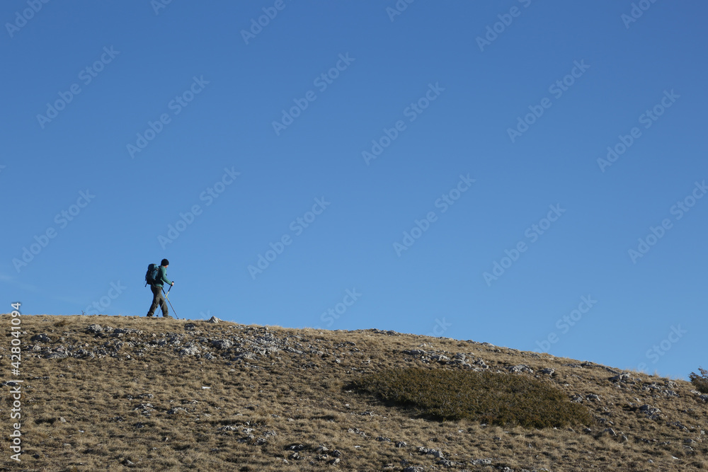Mountaineers walking at Bistra Mountains in Mavrovo National Park, Macedonia.