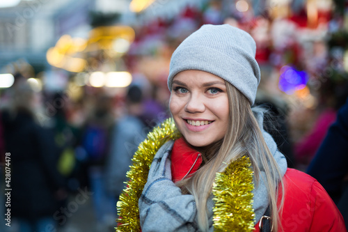 Portrait of young woman smiling happy on Christmas market © JackF