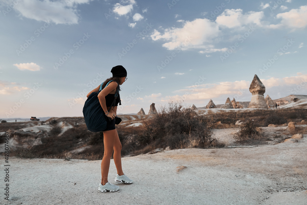 Beautiful tourist woman walking in Love valley in Goreme village