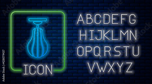 Glowing neon Punching bag icon isolated on brick wall background. Neon light alphabet. Vector