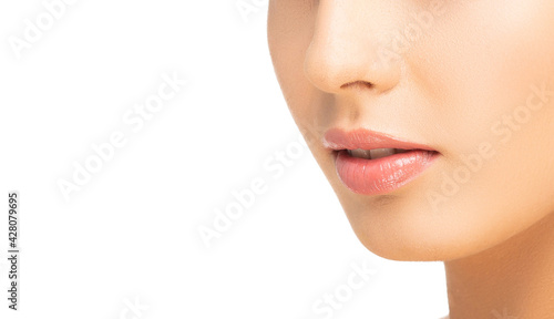 Face of a beautiful oriental brunette girl. Close-up portrait of young and attractive woman with brown eyes.