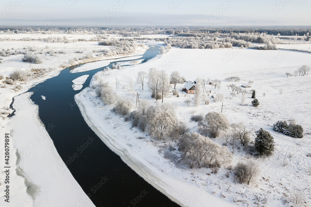 Aerial view of river Venta on a snowy winter day. Skrunda, Latvia.