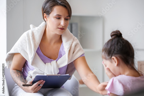 Female psychologist working...