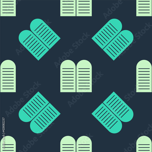 Green and beige The commandments icon isolated seamless pattern on blue background. Gods law concept. Vector