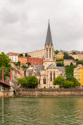 Vieux-Lyon, Saint-Georges church, colorful houses and footbridge in the center, on the river Saone 
