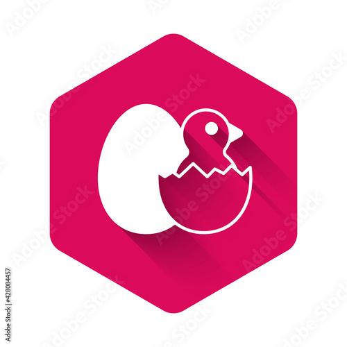 White Little chick in cracked egg icon isolated with long shadow background. Pink hexagon button. Vector