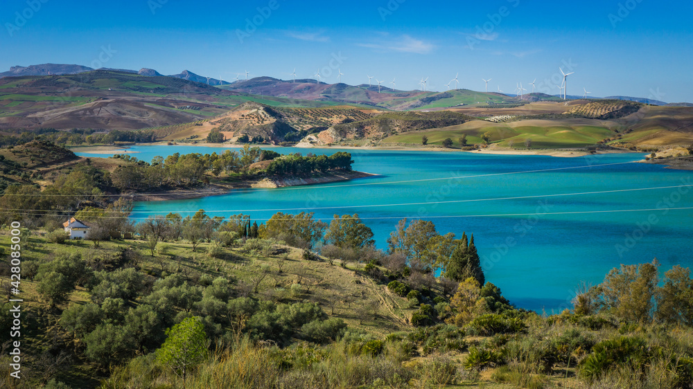 View on the turquoise water of the Guadalhorce and Guadalteba Reservoirs, two artificial lakes in the andalusian backcountry in Spain