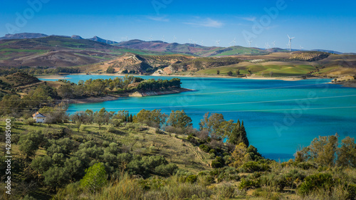 View on the turquoise water of the Guadalhorce and Guadalteba Reservoirs, two artificial lakes in the andalusian backcountry in Spain