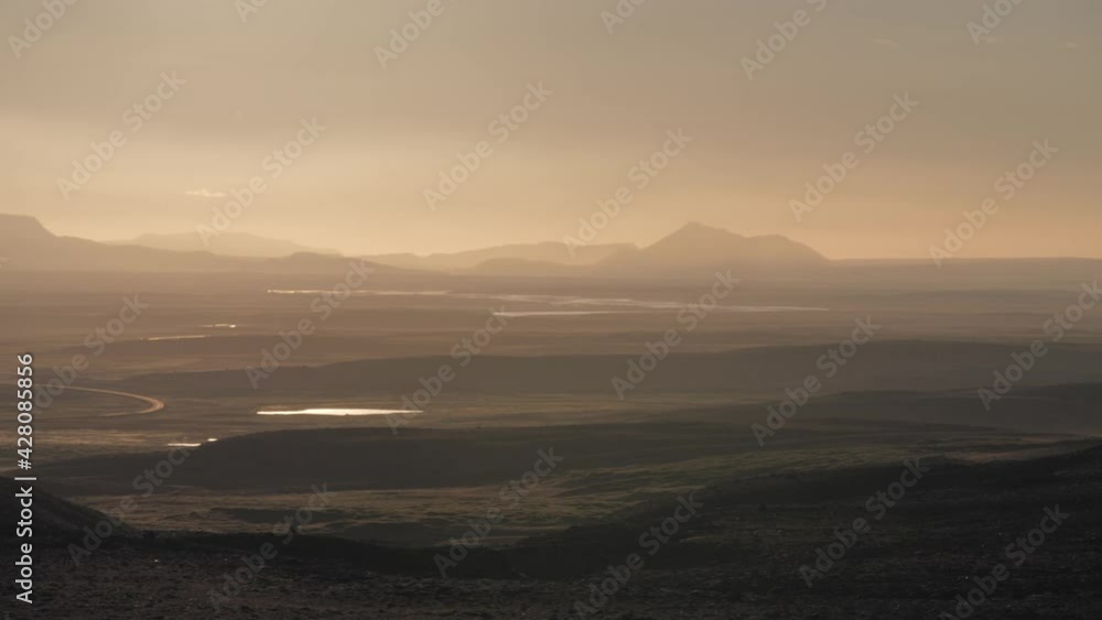 custom made wallpaper toronto digitalVolcanoes in the distance along ring road in Iceland during a cold sunset afternoon, Wide panorama pan right shot