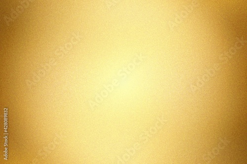 Glowing gold painted metal wall with copy space, abstract texture background