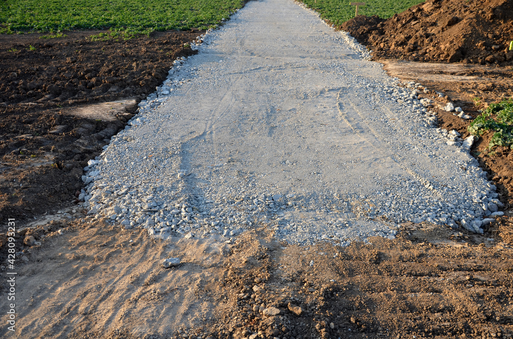 a new path through the fields. an excavator and a grader drove the way ...