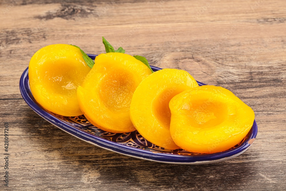 Sweet ripe canned peaches with mint Sweet ripe canned peaches with mint