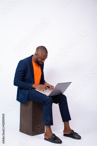 handsome young black man using a laptop