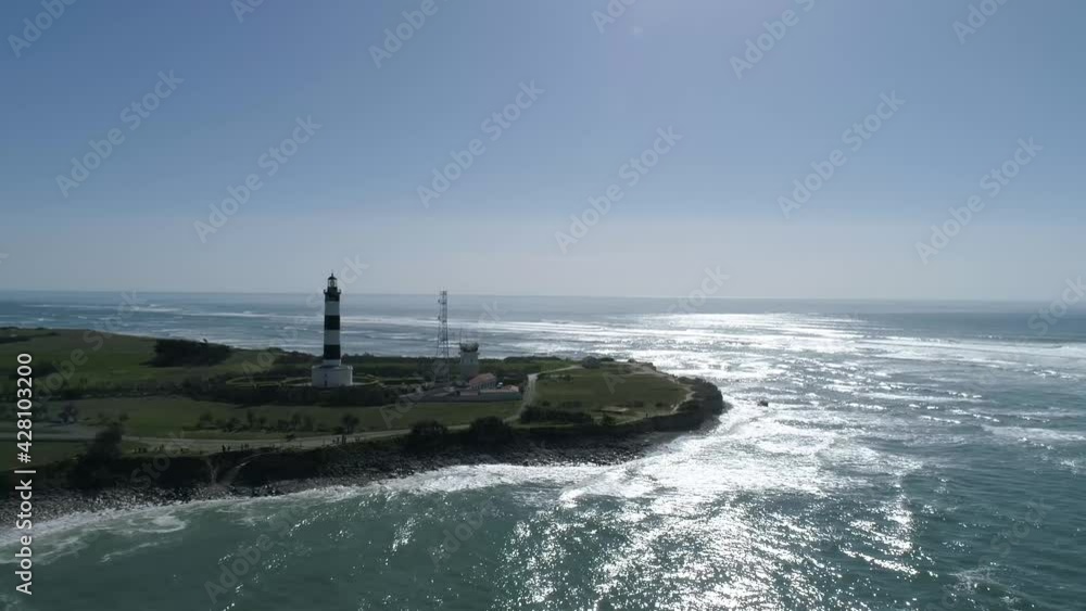 Striped Chassiron lighthouse at the north edge of Oleron Island in Western France, Aerial orbit around shot Striped Chassiron lighthouse at the north edge of Oleron Island in Western France, Aerial orbit around shot