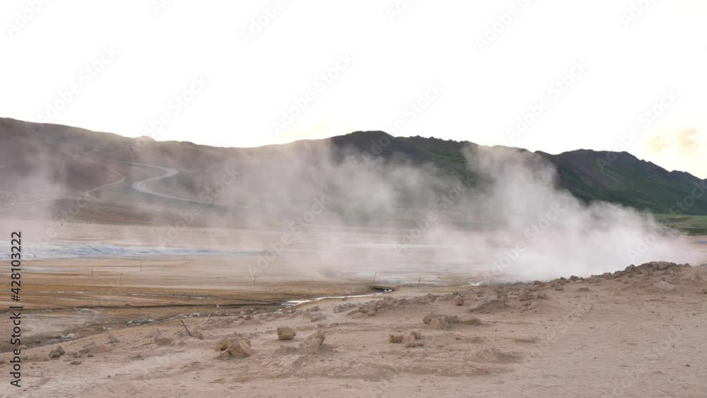 Geothermal mud pit vent at Hverarond Iceland with sulfur vapor emitting, Handheld medium shot Geothermal mud pit vent at Hverarond Iceland with sulfur vapor emitting, Handheld medium shot