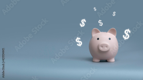 Piggy bank on a grey background with copy space.