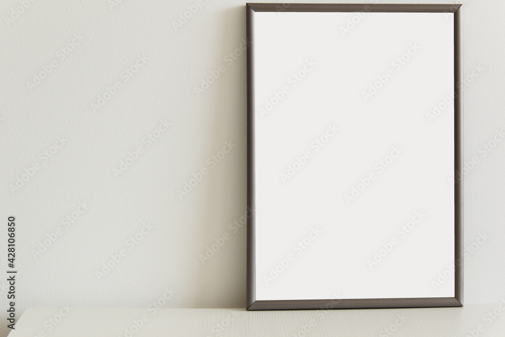 blank vertical portrait frame for images on white table blank vertical portrait frame for images on white table