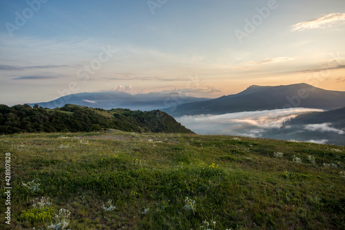 Fototapeta Naklejka Na Ścianę i Meble -  Walking in the mountains.Mount Demerdzhi in the Crimea. Sunset on the mountain. Fog in the mountains.