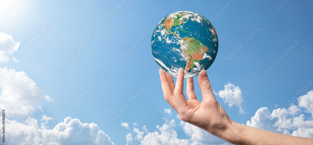 Hands holding a planet, earth on a background of nature blue sky with beautiful white clouds and sunlight.Sustain earth concept. Elements of this image furnished by NASA Hands holding a planet, earth on a background of nature blue sky with beautiful white clouds and sunlight.Sustain earth concept. Elements of this image furnished by NASA